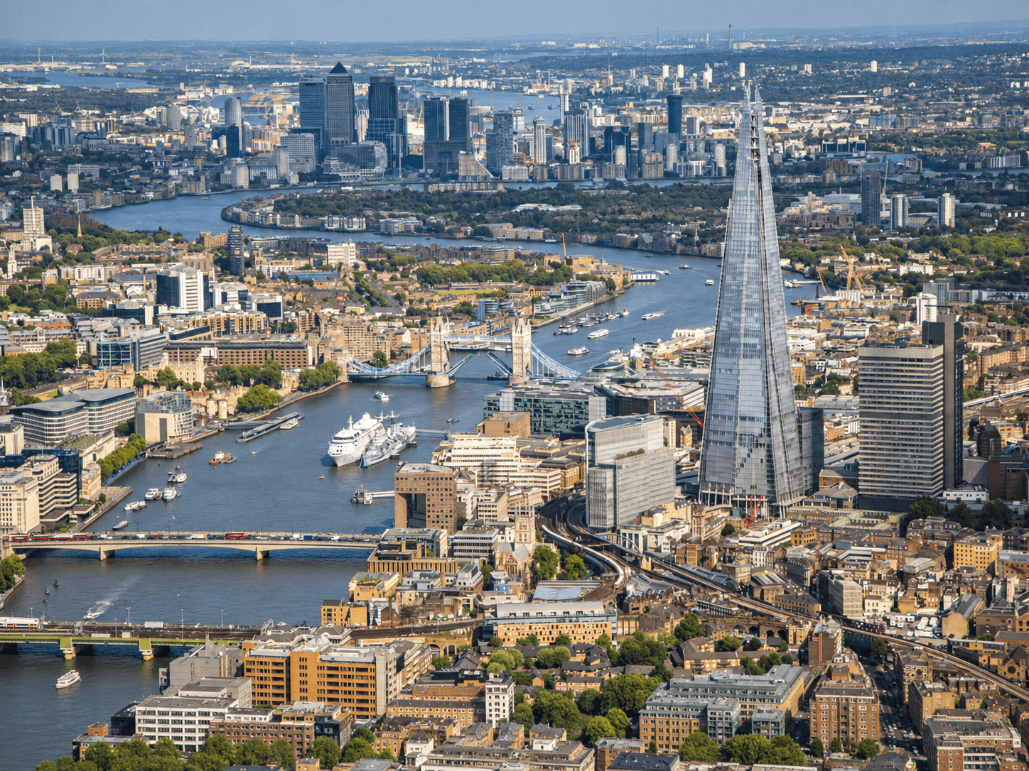 Aerial view of the River Thames, Tower Bridge and The Shard on a London helicopter sightseeing flight